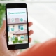 hand-holding-smartphone-with-smart-home-app