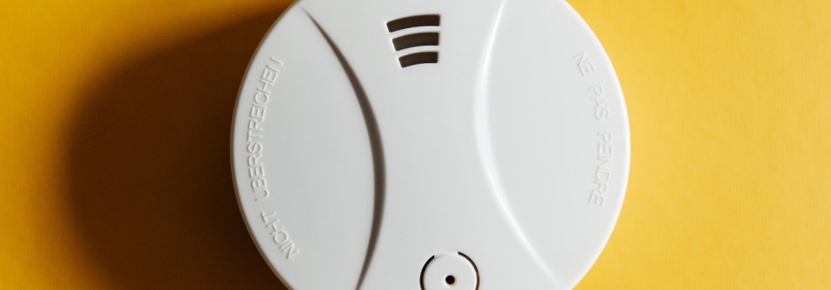 smoke-detector-yellow-ceiling-residential-security-device