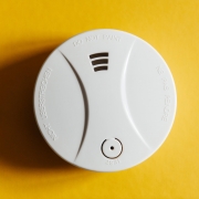 smoke-detector-yellow-ceiling-residential-security-device