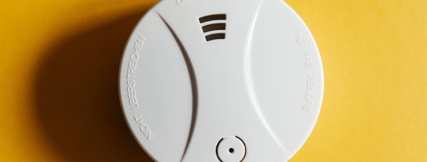 smoke-detector-yellow-ceiling-residential-security-device